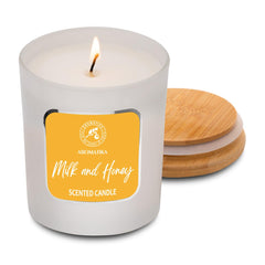 AROMATIKA Milk & Honey jar glowing in a cozy living room.