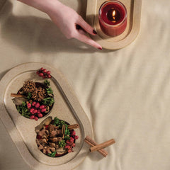 Aromatique candle in a cozy living room creates a welcoming holiday ambiance.
