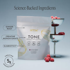 Arrae Tone Gummies bottle beside workout gear highlighting lean muscle definition
