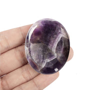 Artistone Amethyst Worry Stone oval held in hand for calm focus during meditation