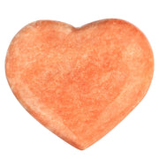 Artistone orange calcite heart close-up for vibrant energy and warmth