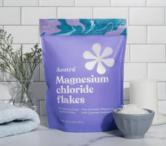 ASUTRA rapid absorption bath flakes in a warm bath for quick relaxation.