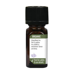 Aura Cacia lime oil bottle pour for DIY skincare blends.