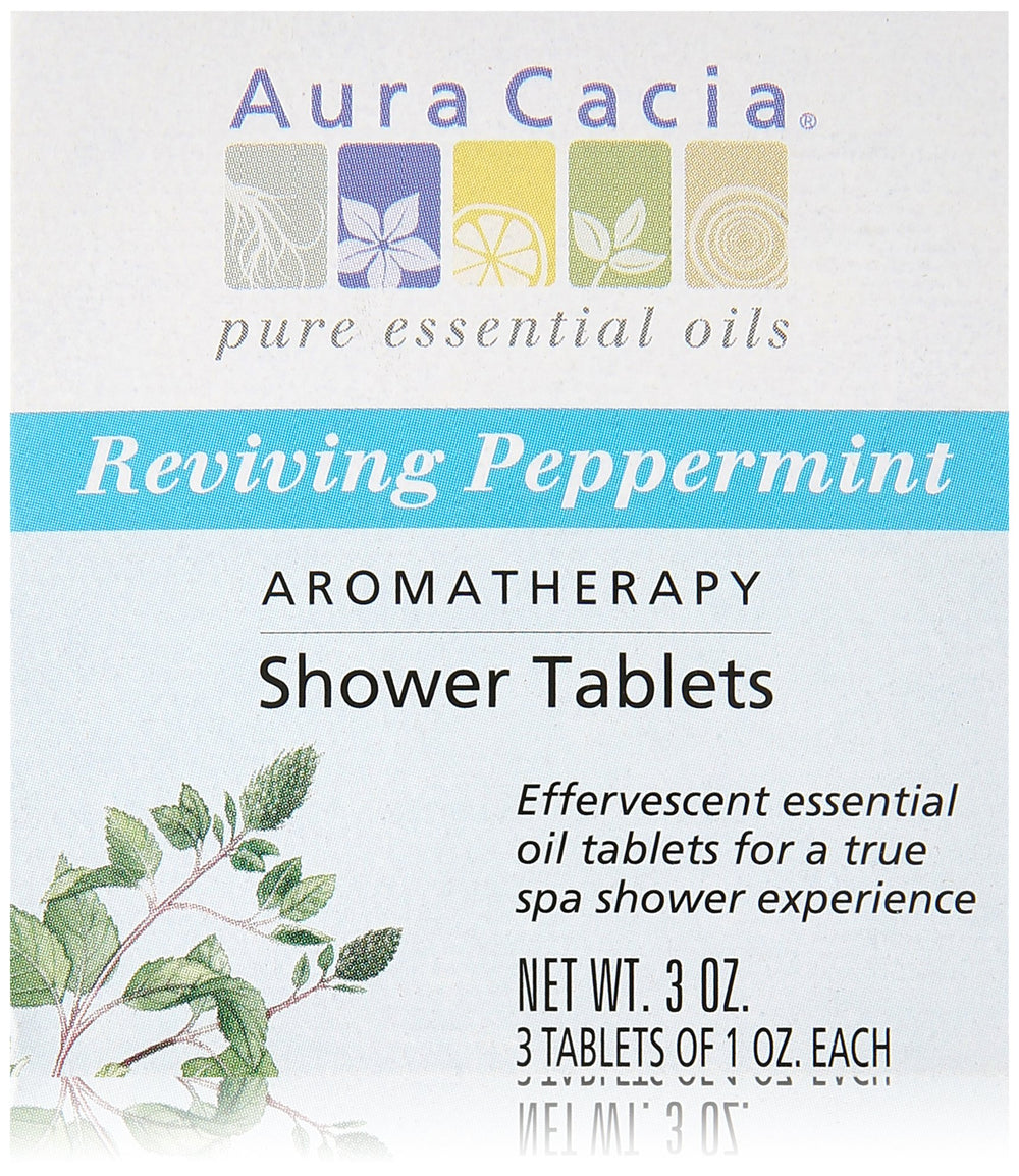 Aura Cacia peppermint shower tablet on shower floor delivering invigorating mint scent