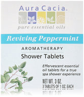 Aura Cacia peppermint shower tablet on shower floor delivering invigorating mint scent