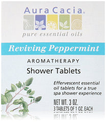 Aura Cacia peppermint shower tablet on shower floor delivering invigorating mint scent
