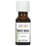 Aura Cacia Sweet Basil oil bottle pour for a refreshing diffuser aroma.