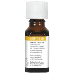 Aura Cacia Roman Chamomile in Jojoba lifestyle scene suggests soothing self-care rituals.