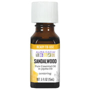Aura Cacia sandalwood in jojoba oil bottle ready for quick skin care.