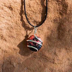 Ayana Rhodonite pendant close-up showcases natural pink hues.