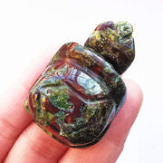 Bacatgem dragon blood jasper tortoise figurine, front view, enhances room serenity and charm.