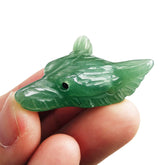 Bacatgem wolf head figurine close-up in green aventurine for calm energy.