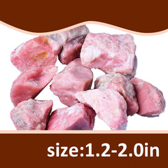 Bairdish pink opal raw stones arranged for décor display.