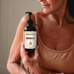 Banyan Botanicals Nirgundi Oil+ oil bottle on table ready for routine care