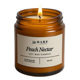 Bare Botanics Peach Nectar in an amber jar with a warm, cozy glow.