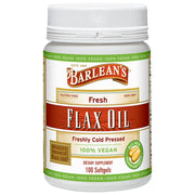 Barlean's Vegan Flaxseed Oil Softgels bottle on kitchen counter for daily omega support.