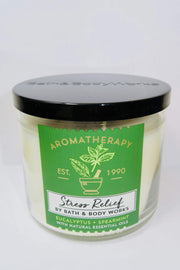 Bath and Body Works Aromatherapy Stress Relief candle in glass jar with eucalyptus spearmint promotes calm ambiance.