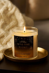 Bath & Body Works Into The Night candle flame close-up emphasizes warm amber notes.
