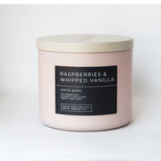 Bath & Body Works White Barn candle jar with raspberry and vanilla notes for cozy ambiance.