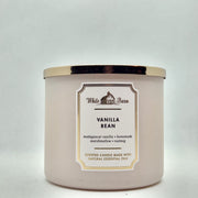 Bath & Body Works White Barn Vanilla Bean 3-Wick candle in a jar for cozy evenings.