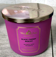 Bath & Body Works White Barn candle with black cherry merlot pour for cozy ambiance.