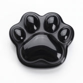 BEAUSIOO Obsidian animal paw worry stone close-up of polished surface highlighting gloss for daily use