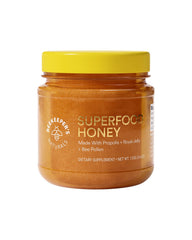 Beekeeper's Naturals Superfood Honey bottle with golden drizzle illustrating natural energy