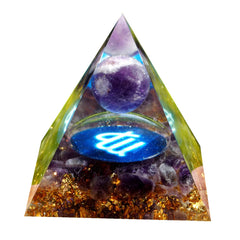 Besorgone Orgone Pyramid EMF protection near devices for calm focus.
