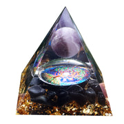 Besorgone orgonite pyramid amethyst close-up for calming focus during meditation.