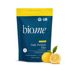 Bio.me Daily Prebiotic Fiber Lemonade bottle pouring for hydration and gut balance.