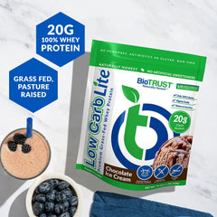 BioTrust Low Carb Lite whey protein powder being scooped for a quick low-carb snack.