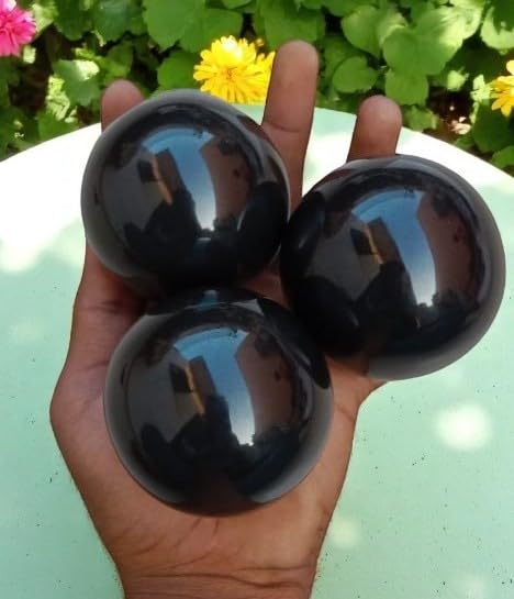 Black Obsidian Sphere 60-70mm on display, offering protective energy and grounding.