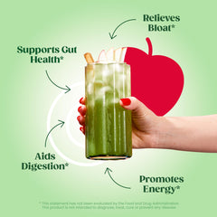 Bloom Nutrition greens powder in a glass ready for a vibrant juice.