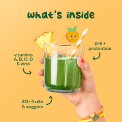 Child drinking a green smoothie powered by Bloom Nutrition greens powder.