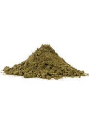 Pouring Bob's Red Mill hemp protein powder into a cup to create a shake.