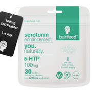 Brain Feed serotonin tablet close-up showing 100 mg 5-HTP for mood support.