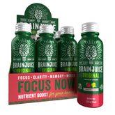 BrainJuice Energy & Focus Shot bottle on desk for quick mental clarity