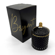 BRIGANTI Vanilla Cupcake candle in a black glass jar releases a warm, inviting aroma.