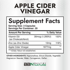 Built by Nature ACV capsules being poured, highlighting convenient dosage for digestion support.