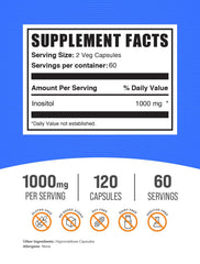 BulkSupplements Inositol capsules poured into a scoop for easy dosing.