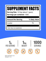 Close-up of BulkSupplements Inositol powder with a measuring scoop.