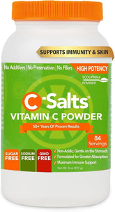 C-Salts Vitamin C powder with scoop beside water for easy daily use.