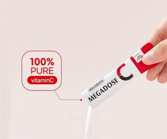 Caincosmetic Megadose Vitamin C powder being poured into water for quick mix.