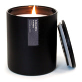 Calyan Wax Co. Oakmoss & Amber candle label highlights premium fragrance notes.