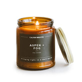 Calyan Wax Co. Aspen & Fog candle in amber jar front view for elegant home ambiance