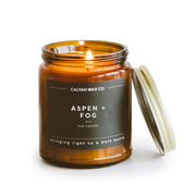 Calyan Wax Co. Aspen & Fog candle in amber jar front view for elegant home ambiance