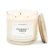 Calyan Wax Co Oakmoss Amber 3-wick candle in glass jar for ambient home glow