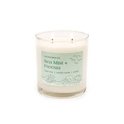 Calyan Wax Co Sea Mist & Freesia 2-wick candle in a glass jar for living rooms.