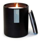 Calyan Wax Co. Seaside Citrus candle in a black jar adds fresh coastal aroma to any room.