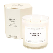 Calyan Wax Co Vetiver Tonka 2 Wick candle in a glass jar creates warm ambience.